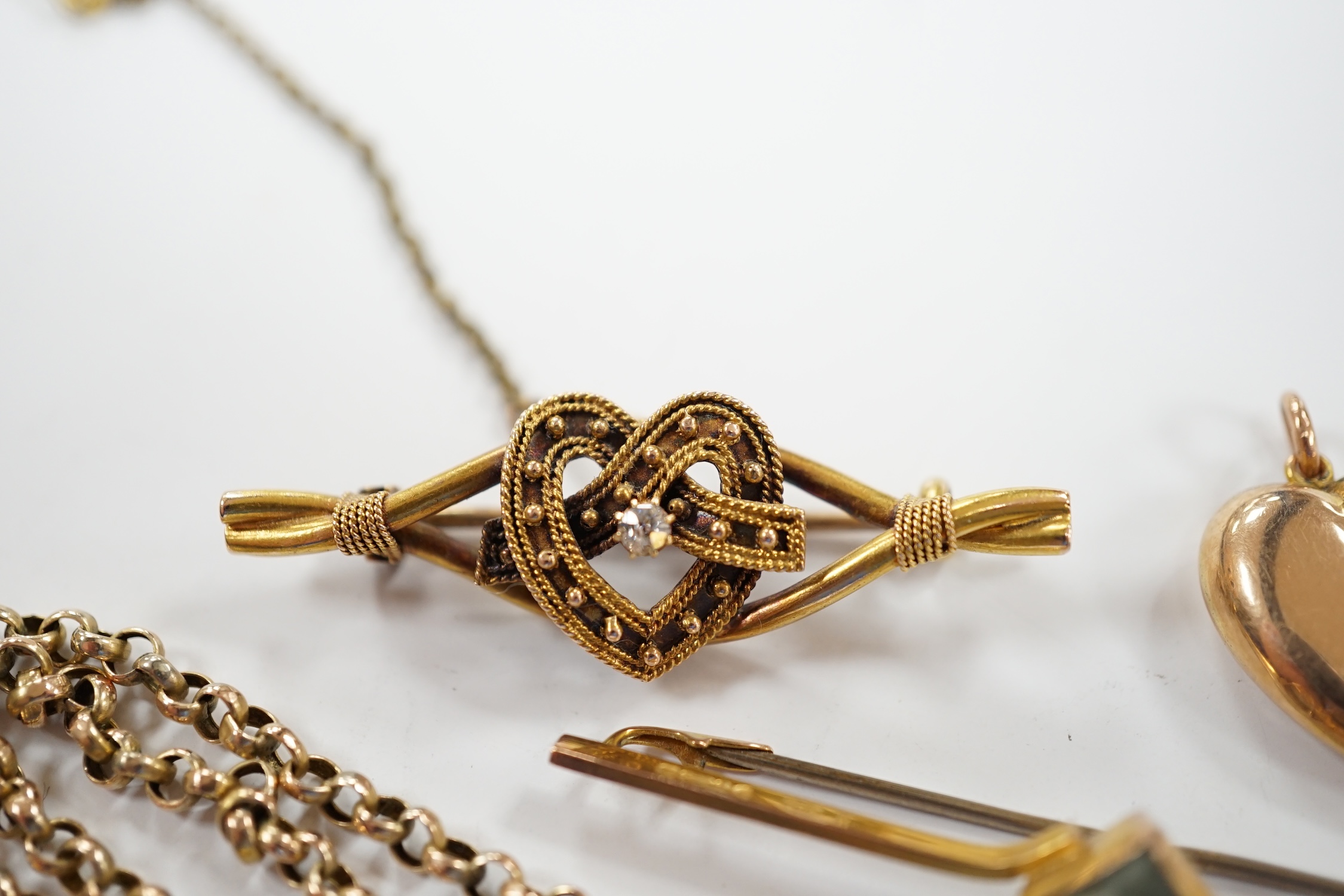 A 9ct chain, 42cm, a 15ct and diamond set heart shaped bar brooch, a 9ct and gem set bar brooch and a 9ct and seed pearl set heart shaped pendant.